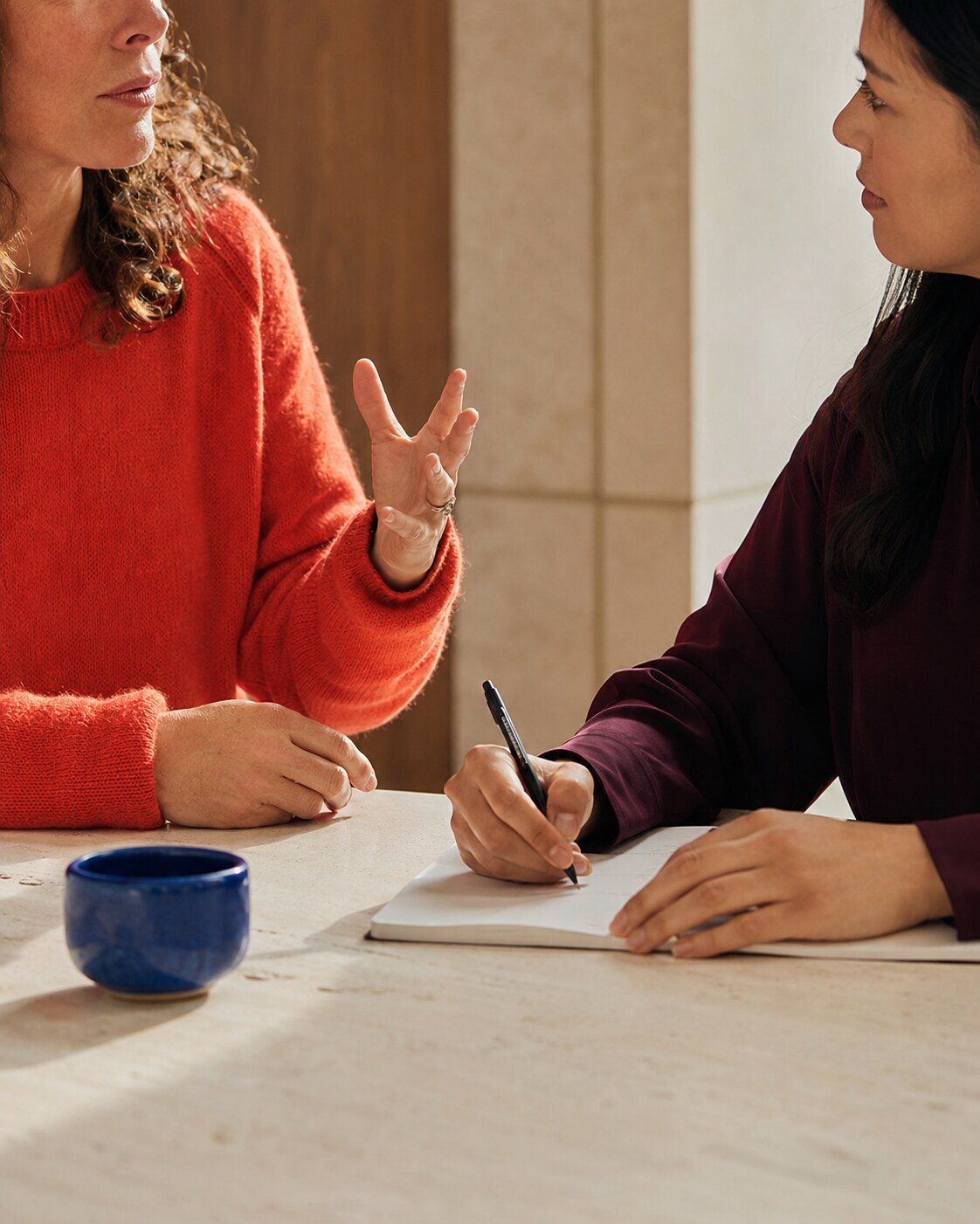 AI-generated editorial image of two adults in conversation.